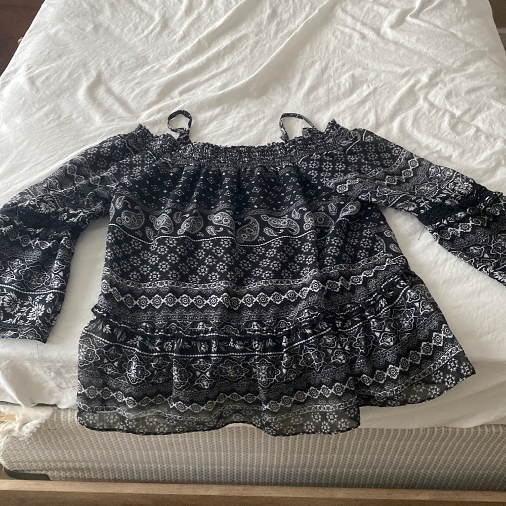 Long sleeved patterned black shoulder less Adult Medium Sized top.
